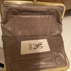 Selling purse and wallet together very good condition.taupe color